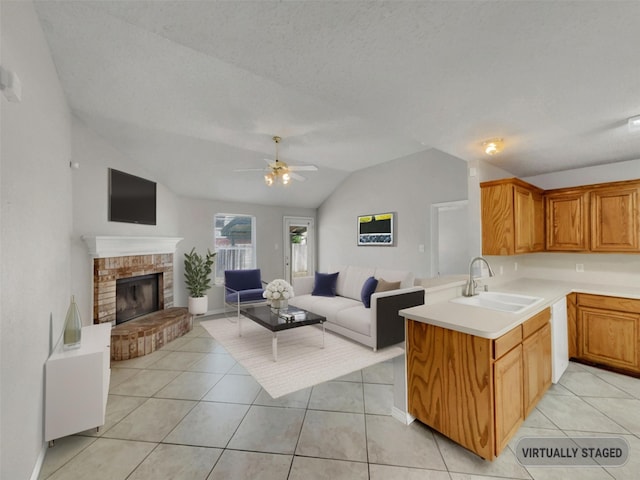 1301 Archdale Ct, Fort Worth, TX 76028 - kitchen with a sink, lofted ceiling, open floor plan, light countertops, and light tile patterned floors