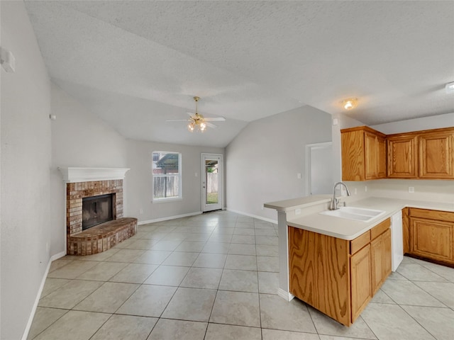 1301 Archdale Ct, Fort Worth, TX 76028 - kitchen with a sink, light tile patterned flooring, lofted ceiling, open floor plan, and light countertops