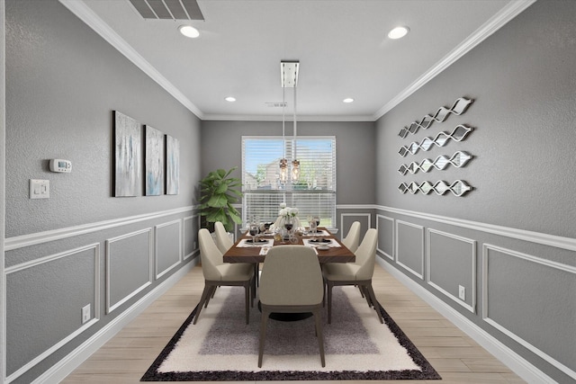 7401 Sabine Dr, Mckinney, TX 75071 - dining room with light wood-style flooring, a decorative wall, crown molding, a wainscoted wall, and recessed lighting