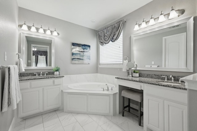 7401 Sabine Dr, Mckinney, TX 75071 - full bathroom featuring marble finish floors, a garden tub, and two vanities
