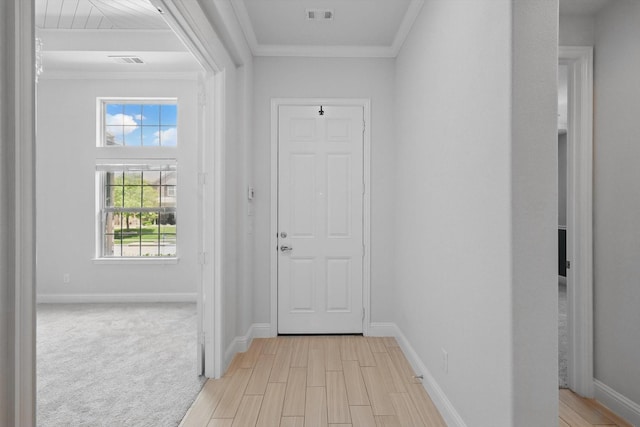 7401 Sabine Dr, Mckinney, TX 75071 - entrance foyer featuring crown molding, healthy amount of natural light, baseboards, and light wood finished floors