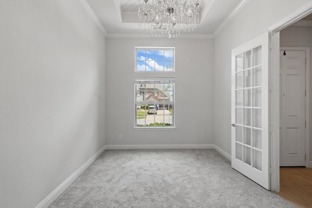 7401 Sabine Dr, Mckinney, TX 75071 - carpeted spare room featuring a chandelier, ornamental molding, a raised ceiling, and baseboards