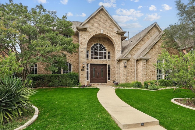 1925 Kiestwood Cir, Plano, TX 75025 - entrance to property with a lawn, french doors, and brick siding