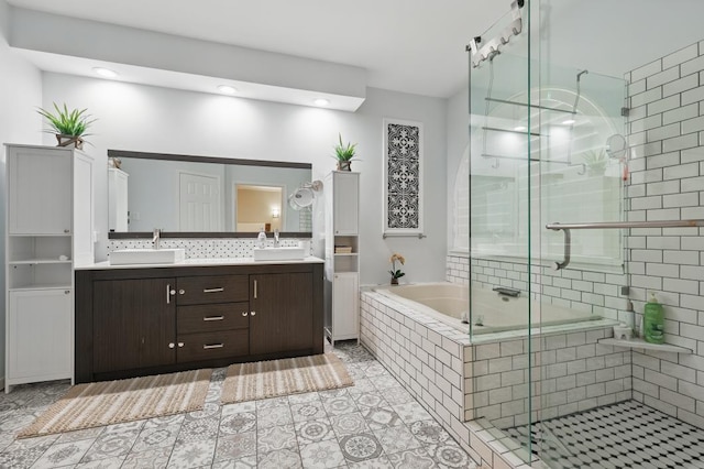 1925 Kiestwood Cir, Plano, TX 75025 - bathroom featuring a stall shower, a bath, double vanity, and recessed lighting