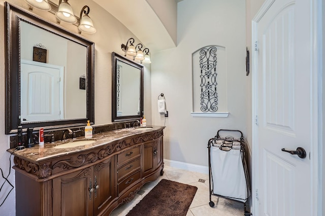 600 Oakmont Ct, Desoto, TX 75115 - bathroom featuring double vanity and baseboards