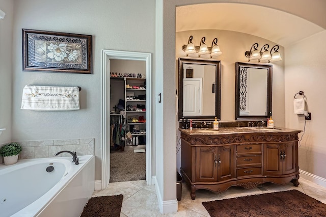 600 Oakmont Ct, Desoto, TX 75115 - full bath featuring a bath, double vanity, tile patterned flooring, a spacious closet, and baseboards