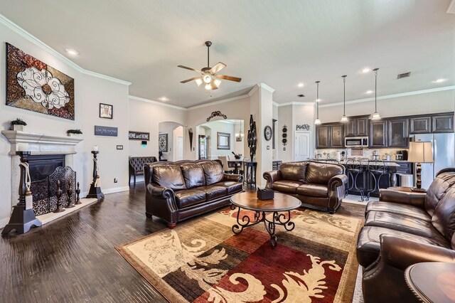 600 Oakmont Ct, Desoto, TX 75115 - living area with arched walkways, ceiling fan, wood finished floors, crown molding, and recessed lighting