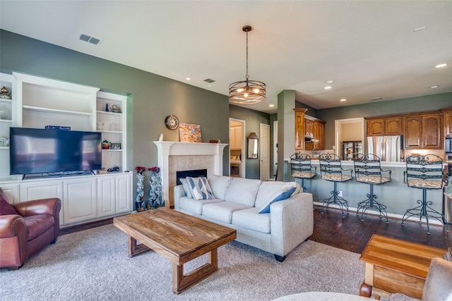 519 Butternut Dr, Garland, TX 75044 - living area with recessed lighting, a fireplace, and wood finished floors