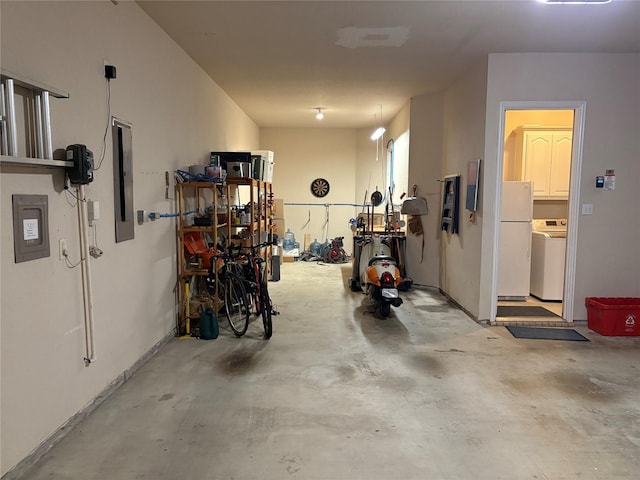 519 Butternut Dr, Garland, TX 75044 - garage with washer / dryer and freestanding refrigerator