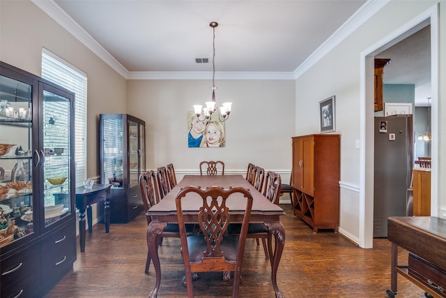 519 Butternut Dr, Garland, TX 75044 - dining space featuring ornamental molding, dark wood finished floors, and a chandelier