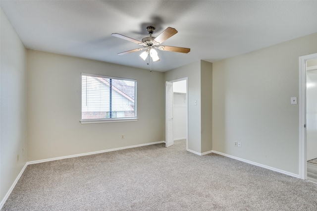 2702 Glen Ridge Dr, Arlington, TX 76016 - unfurnished bedroom with carpet, baseboards, a ceiling fan, and a closet