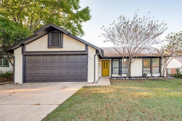 2702 Glen Ridge Dr, Arlington, TX 76016 - view of front of house with brick siding, an attached garage, concrete driveway, and a front lawn