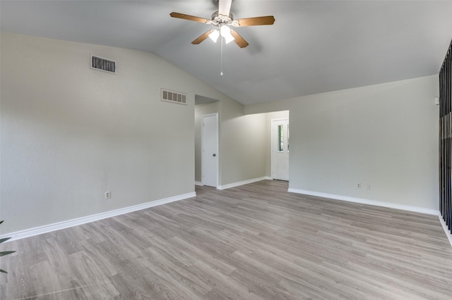 2702 Glen Ridge Dr, Arlington, TX 76016 - empty room with ceiling fan, vaulted ceiling, light wood-style floors, and baseboards