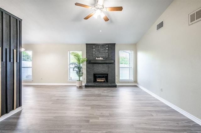 2702 Glen Ridge Dr, Arlington, TX 76016 - unfurnished living room featuring a ceiling fan, wood finished floors, baseboards, and vaulted ceiling