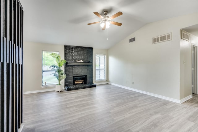 2702 Glen Ridge Dr, Arlington, TX 76016 - unfurnished living room with a ceiling fan, healthy amount of natural light, lofted ceiling, light wood-style flooring, and baseboards