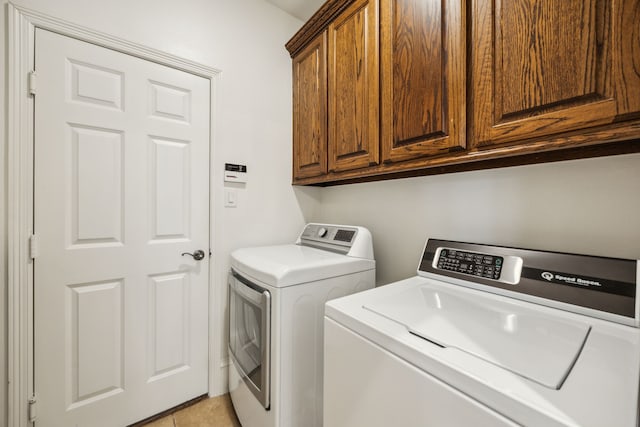 1675 Morris Ln, Frisco, TX 75034 - laundry room featuring washing machine and dryer, cabinet space, and light tile patterned floors