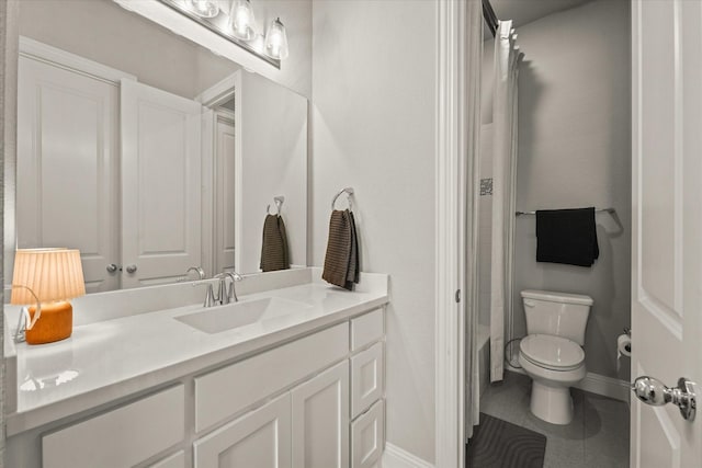 2605 Patton Dr, Melissa, TX 75454 - bathroom with toilet, vanity, baseboards, and tile patterned floors