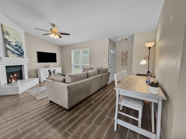 2114 Cottage Oak Ln, Colleyville, TX 76034 - living room featuring ceiling fan, dark wood-type flooring, vaulted ceiling, and a brick fireplace