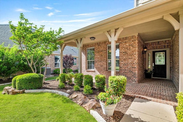 402 Pebble Beach Dr, Frisco, TX 75036 - doorway to property featuring brick siding and a lawn