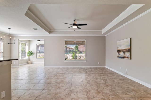 402 Pebble Beach Dr, Frisco, TX 75036 - spare room with a tray ceiling, a chandelier, crown molding, light tile patterned floors, and ceiling fan