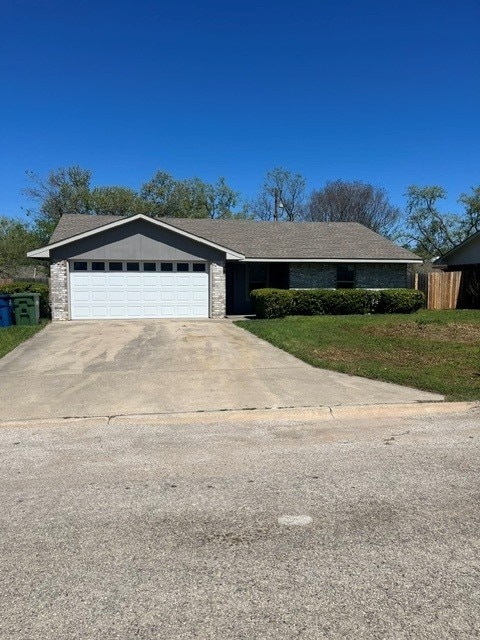 103 David Dr, Sanger, TX 76266 - view of front of home with a garage, concrete driveway, and fence