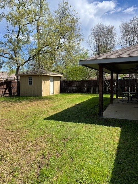 103 David Dr, Sanger, TX 76266 - view of yard with a patio, an outbuilding, and a storage unit