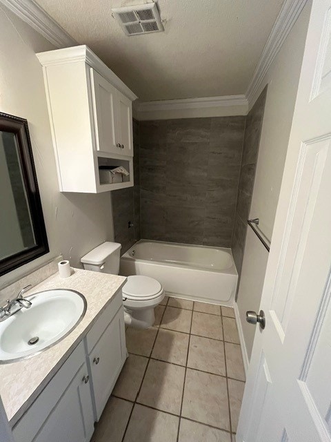 103 David Dr, Sanger, TX 76266 - full bath featuring toilet, vanity, tile patterned floors, ornamental molding, and a textured ceiling