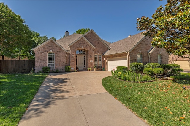4301 Sandra Lynn Dr, Flower Mound, TX 75022 - traditional home featuring brick siding, a chimney, a garage, and concrete driveway