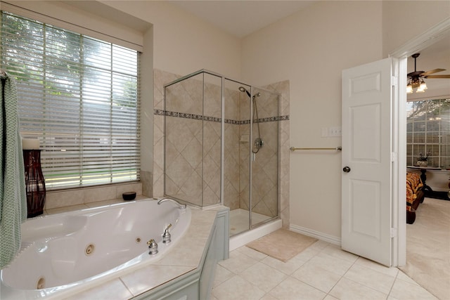 4301 Sandra Lynn Dr, Flower Mound, TX 75022 - ensuite bathroom with a shower stall, tile patterned floors, a whirlpool tub, ceiling fan, and baseboards