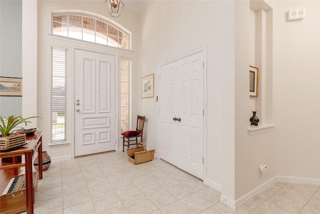 4301 Sandra Lynn Dr, Flower Mound, TX 75022 - entryway featuring a towering ceiling, baseboards, and a chandelier