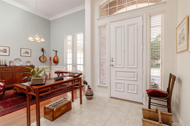 4301 Sandra Lynn Dr, Flower Mound, TX 75022 - foyer with a chandelier, crown molding, healthy amount of natural light, light tile patterned floors, and baseboards