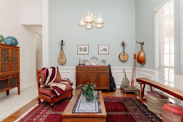 4301 Sandra Lynn Dr, Flower Mound, TX 75022 - living area featuring a chandelier, a wainscoted wall, plenty of natural light, a decorative wall, and tile patterned floors