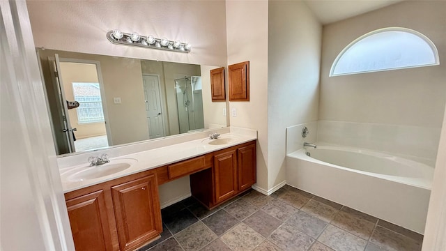 1924 Cliffrose Dr, Little Elm, TX 75068 - bathroom featuring plenty of natural light, double vanity, a garden tub, and a stall shower