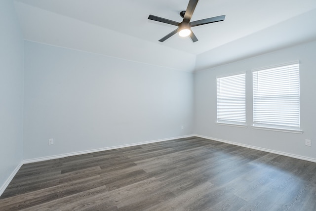 111 Seabiscuit Dr, Caddo Mills, TX 75135 - empty room with a ceiling fan, dark wood-style floors, baseboards, and vaulted ceiling