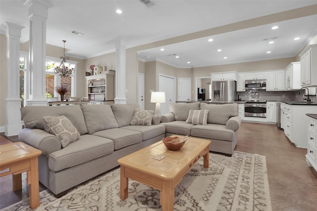 2920 Village Cir, Denison, TX 75020 - living room featuring decorative columns, recessed lighting, crown molding, and a chandelier