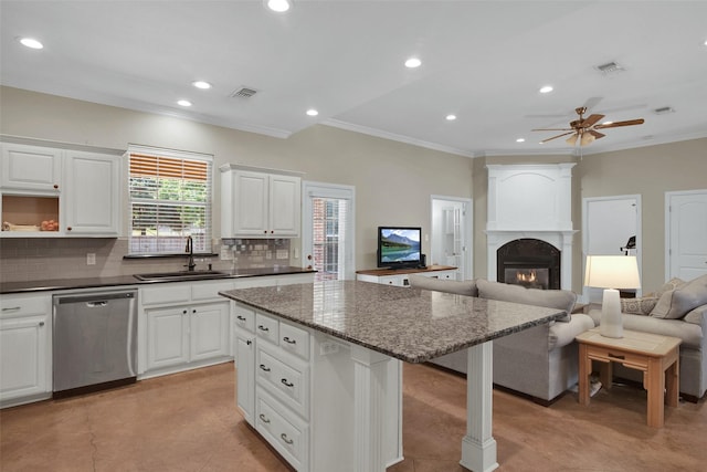 2920 Village Cir, Denison, TX 75020 - kitchen featuring dishwasher, a sink, crown molding, open floor plan, and decorative backsplash