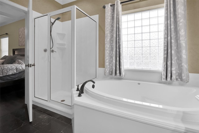 2920 Village Cir, Denison, TX 75020 - bathroom with plenty of natural light, a stall shower, and ensuite bath