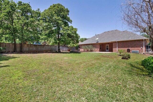 2920 Village Cir, Denison, TX 75020 - view of yard with central AC unit