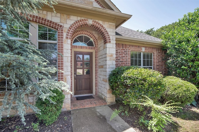 2920 Village Cir, Denison, TX 75020 - entrance to property with brick siding, roof with shingles, and stone siding