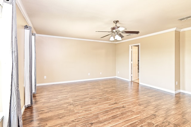 6508 Corral Ln, Denton, TX 76210 - spare room featuring wood finished floors, crown molding, ceiling fan, and baseboards