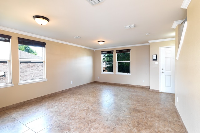 6508 Corral Ln, Denton, TX 76210 - empty room featuring plenty of natural light, crown molding, and baseboards