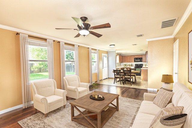 6508 Corral Ln, Denton, TX 76210 - living room with crown molding, a ceiling fan, baseboards, and wood finished floors
