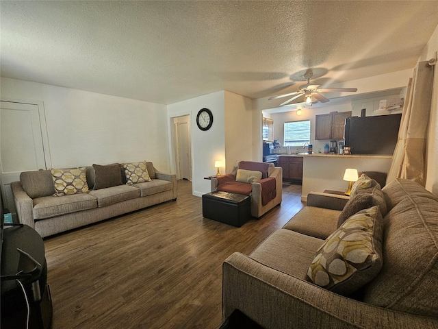 120 E Marguerita Dr, Garland, TX 75040 - living room with dark wood-type flooring, ceiling fan, and a textured ceiling