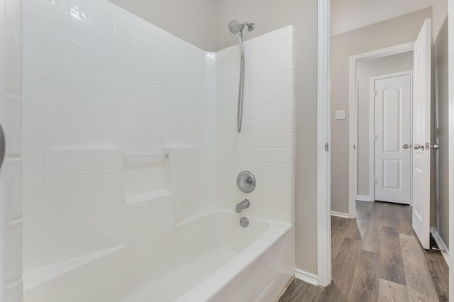 2109 Northridge Dr, Forney, TX 75126 - bathroom with wood finished floors, baseboards, and washtub / shower combination