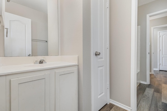 2109 Northridge Dr, Forney, TX 75126 - bathroom with wood finished floors, vanity, and baseboards