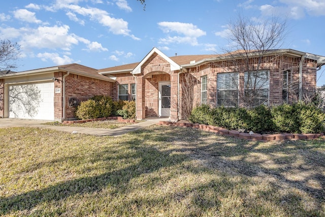 2109 Northridge Dr, Forney, TX 75126 - ranch-style home with brick siding, a front lawn, and a garage