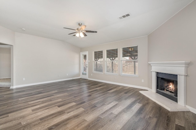 2109 Northridge Dr, Forney, TX 75126 - unfurnished living room with ceiling fan, dark wood-type flooring, a lit fireplace, and baseboards