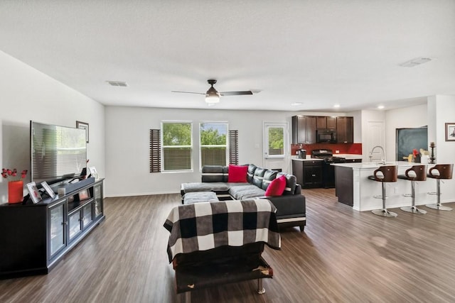 5645 Mcclelland St, Forney, TX 75126 - living room featuring wood finished floors, baseboards, a ceiling fan, and recessed lighting