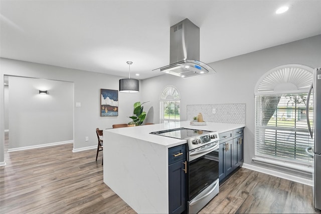 6005 Redwood Ln, Rowlett, TX 75089 - kitchen with island range hood, stainless steel appliances, a peninsula, wood finished floors, and recessed lighting