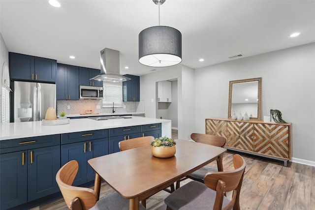 6005 Redwood Ln, Rowlett, TX 75089 - dining space with light wood-style flooring, recessed lighting, and baseboards